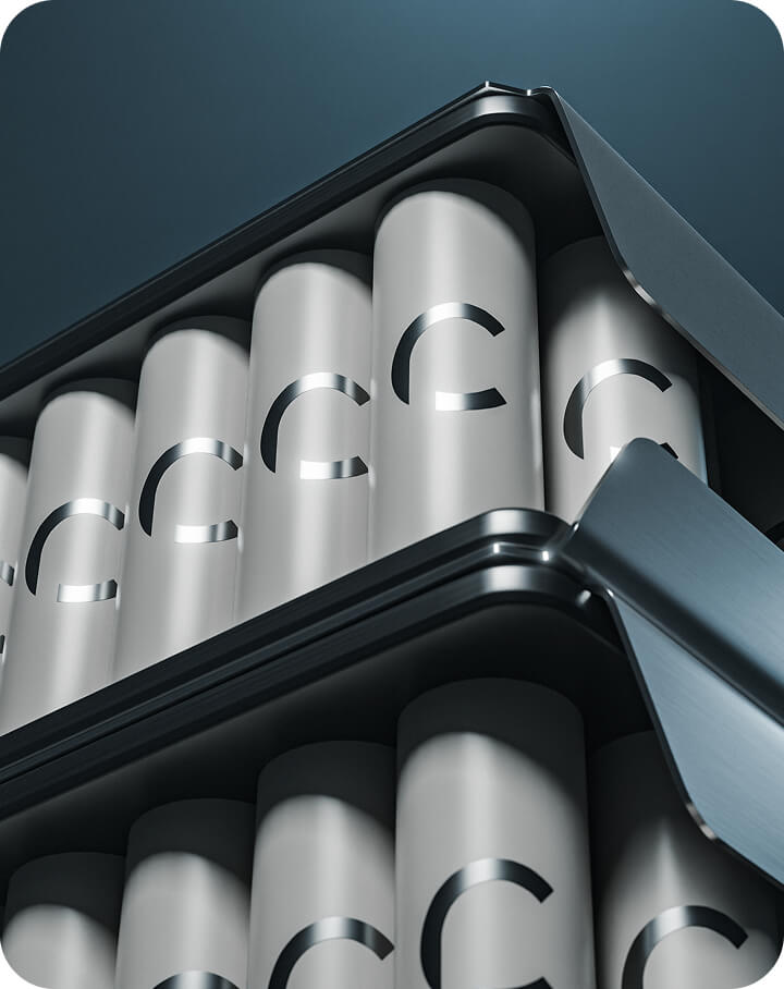 Close-up of cylindrical battery cells arranged in metal trays, each labeled with a large letter “C” on the side, suggesting a modern, clean energy storage or battery system.